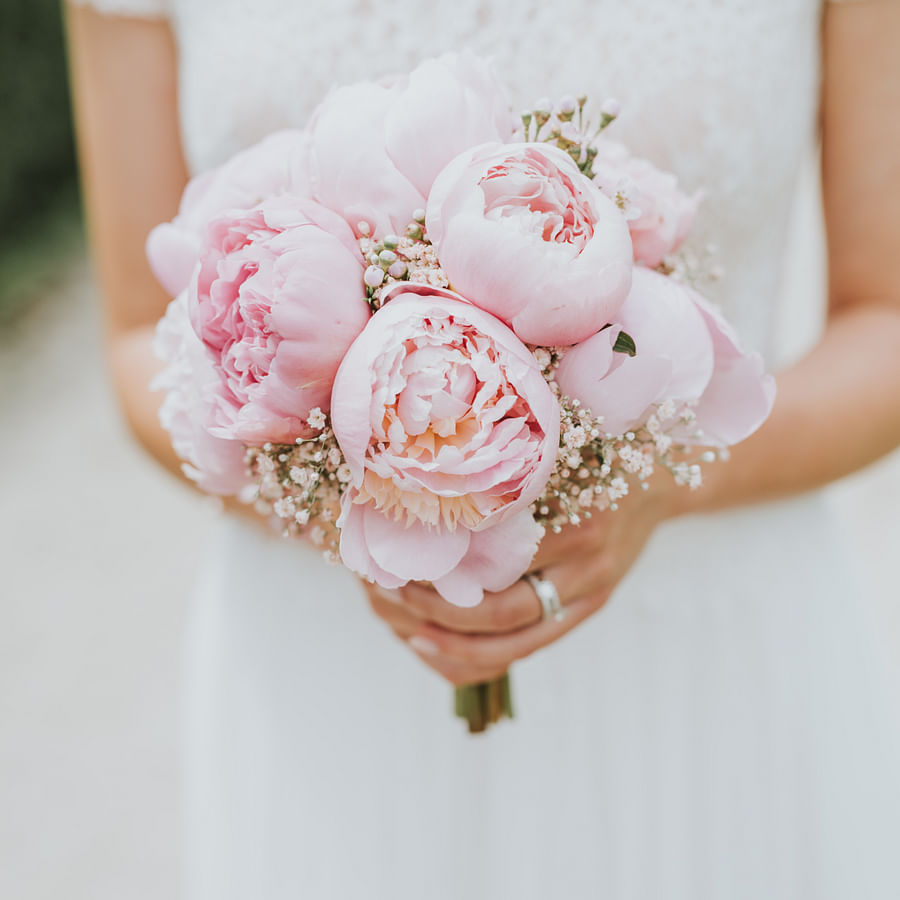 Bride holding a beautiful homemade wedding bouquet
