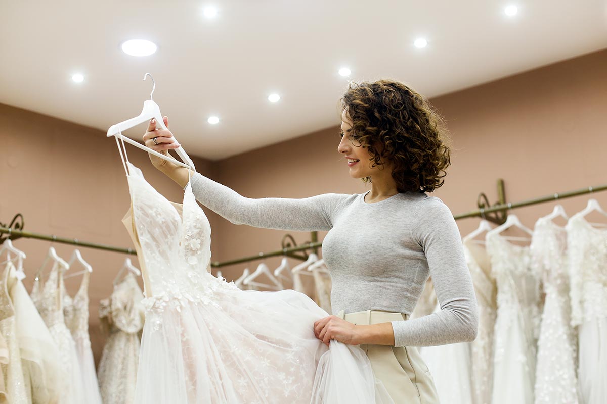 A bride trying on a wedding dress in a bridal salon